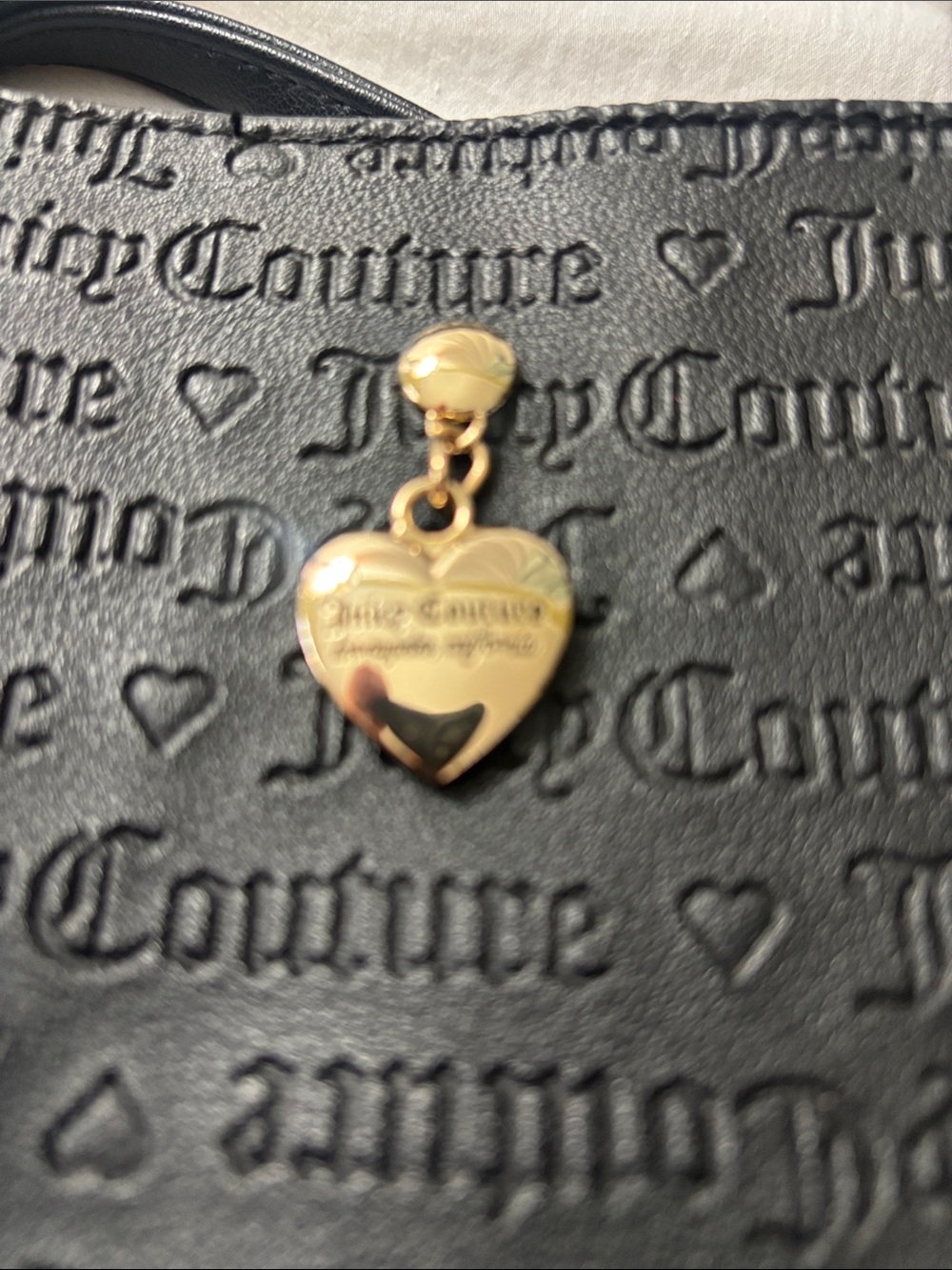 Juicy Couture Black Embossed Wristlet with Gold Heart Charm